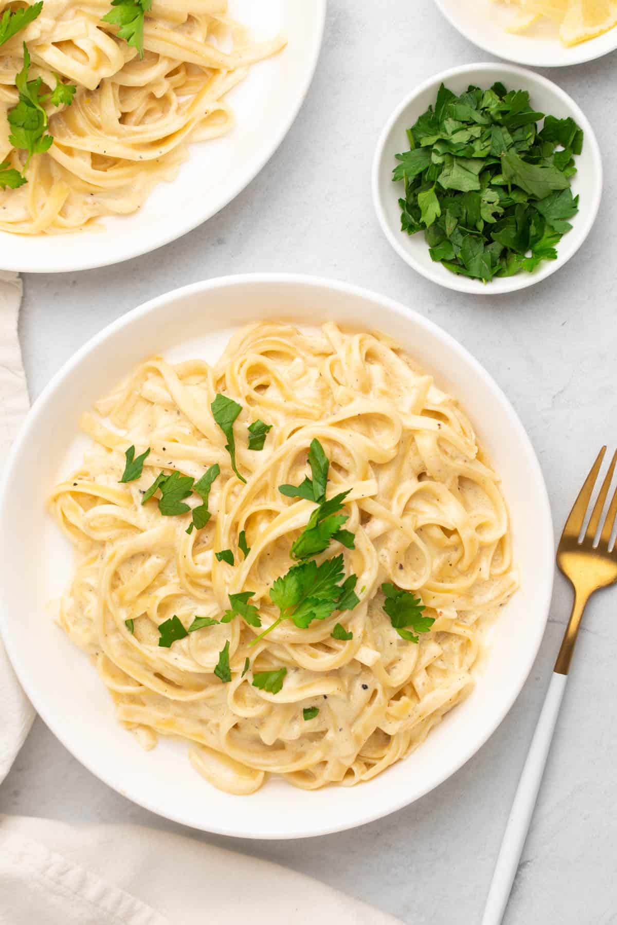 pasta served on a white plate with garnishes 