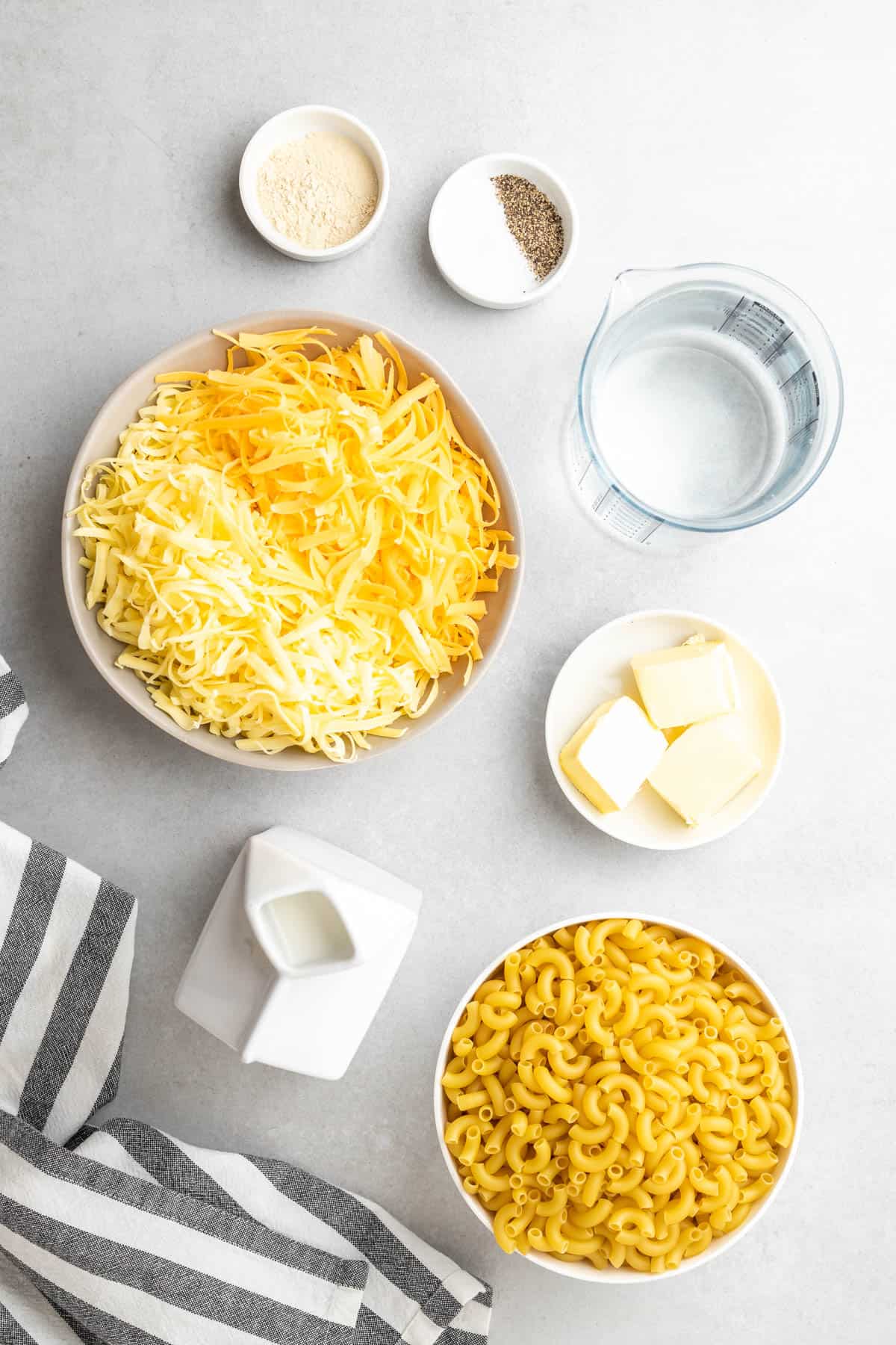ingredients for the Mac and cheese laid out in separate dishes