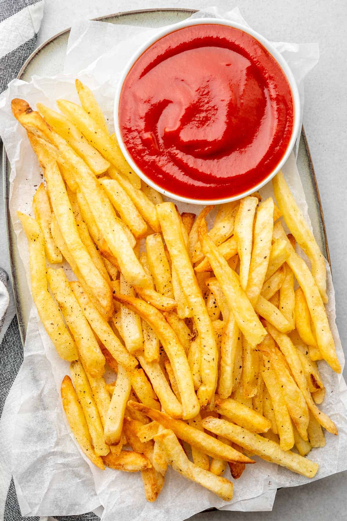 golden and crispy French fries served with ketchup