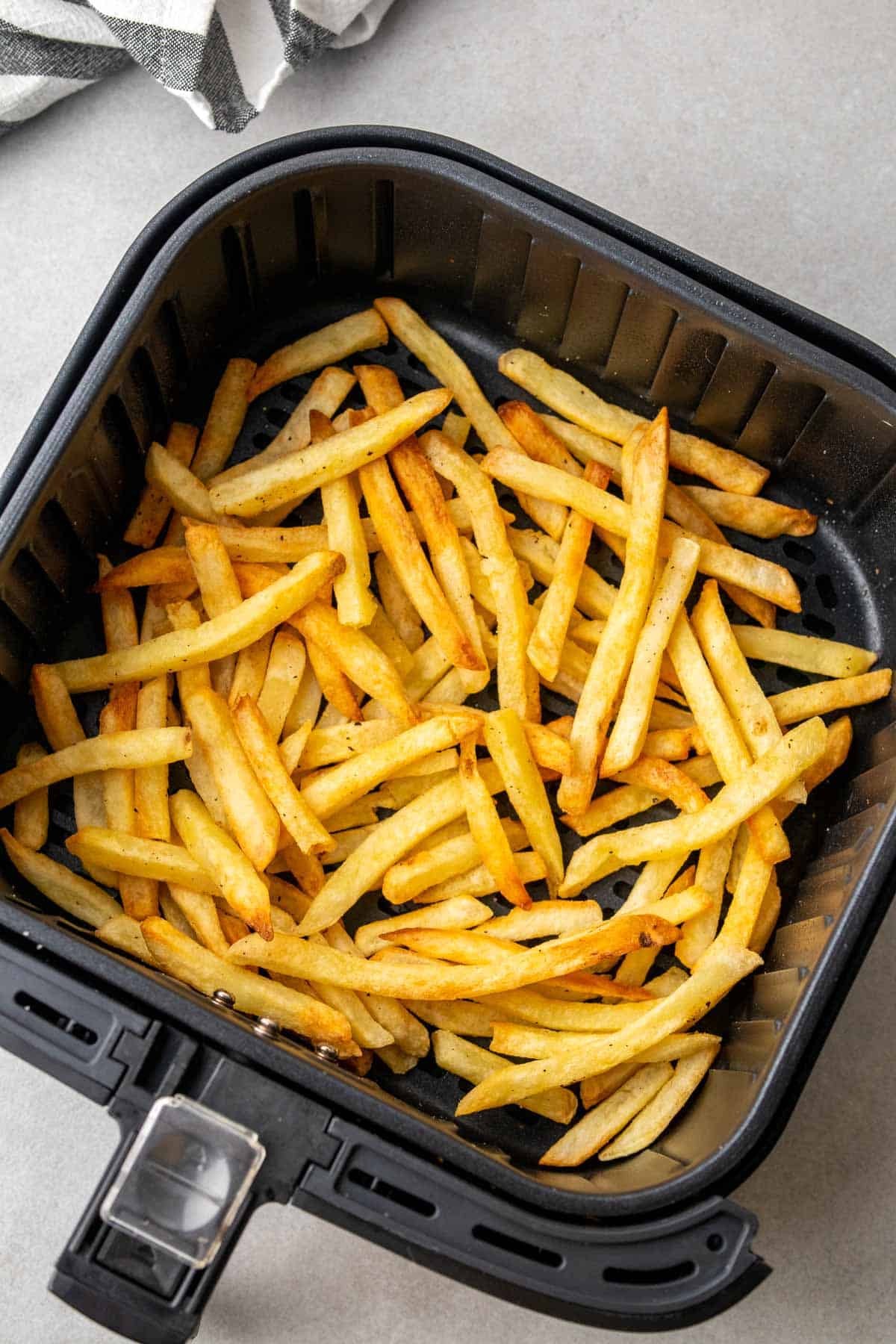 crispy French fries in the air fryer basket