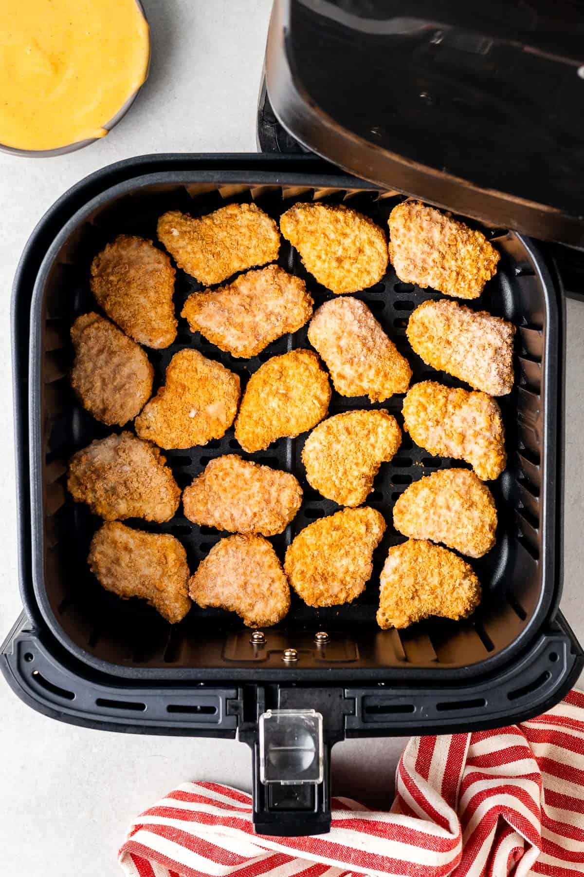 frozen chicken nuggets in a single layer in the air fryer before being cooked