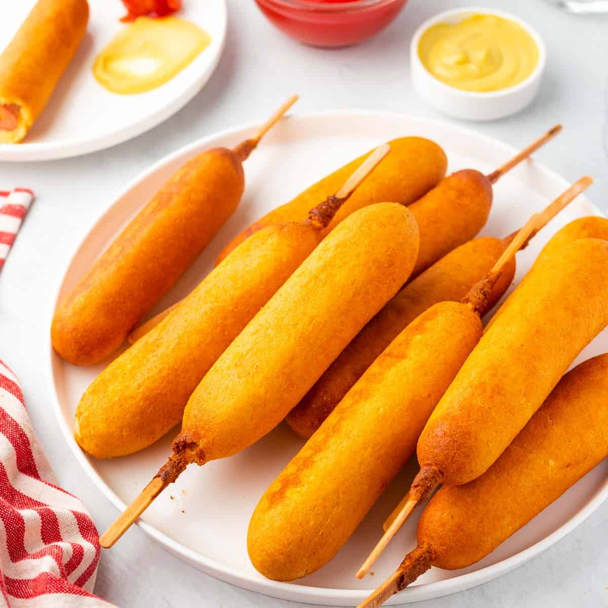 air fried corn dogs served with ketchup and mustard 