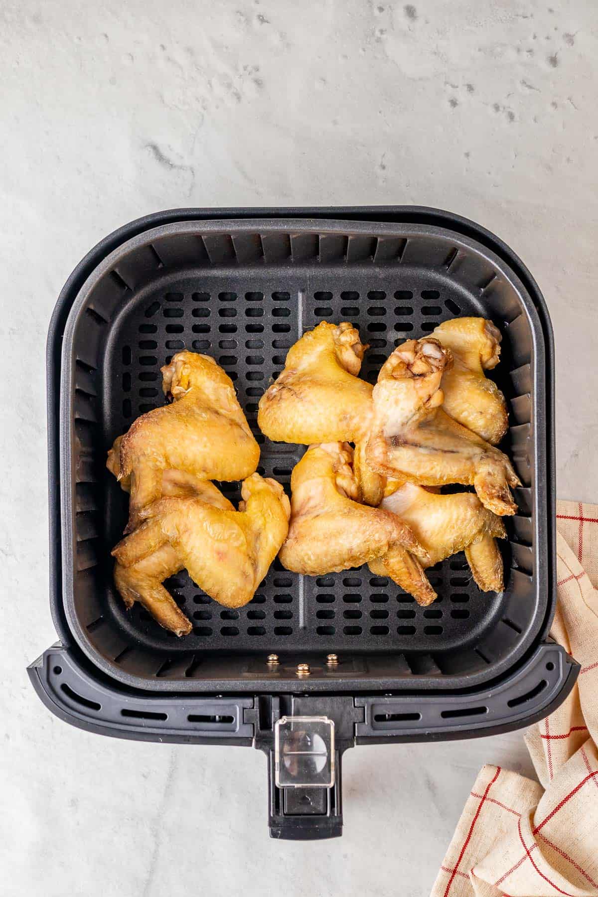 defrosted chicken wings in the air fryer basket