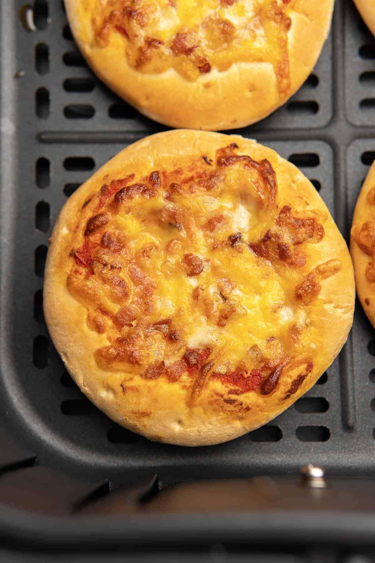 cheesy crispy pizza in the air fryer after being cooked