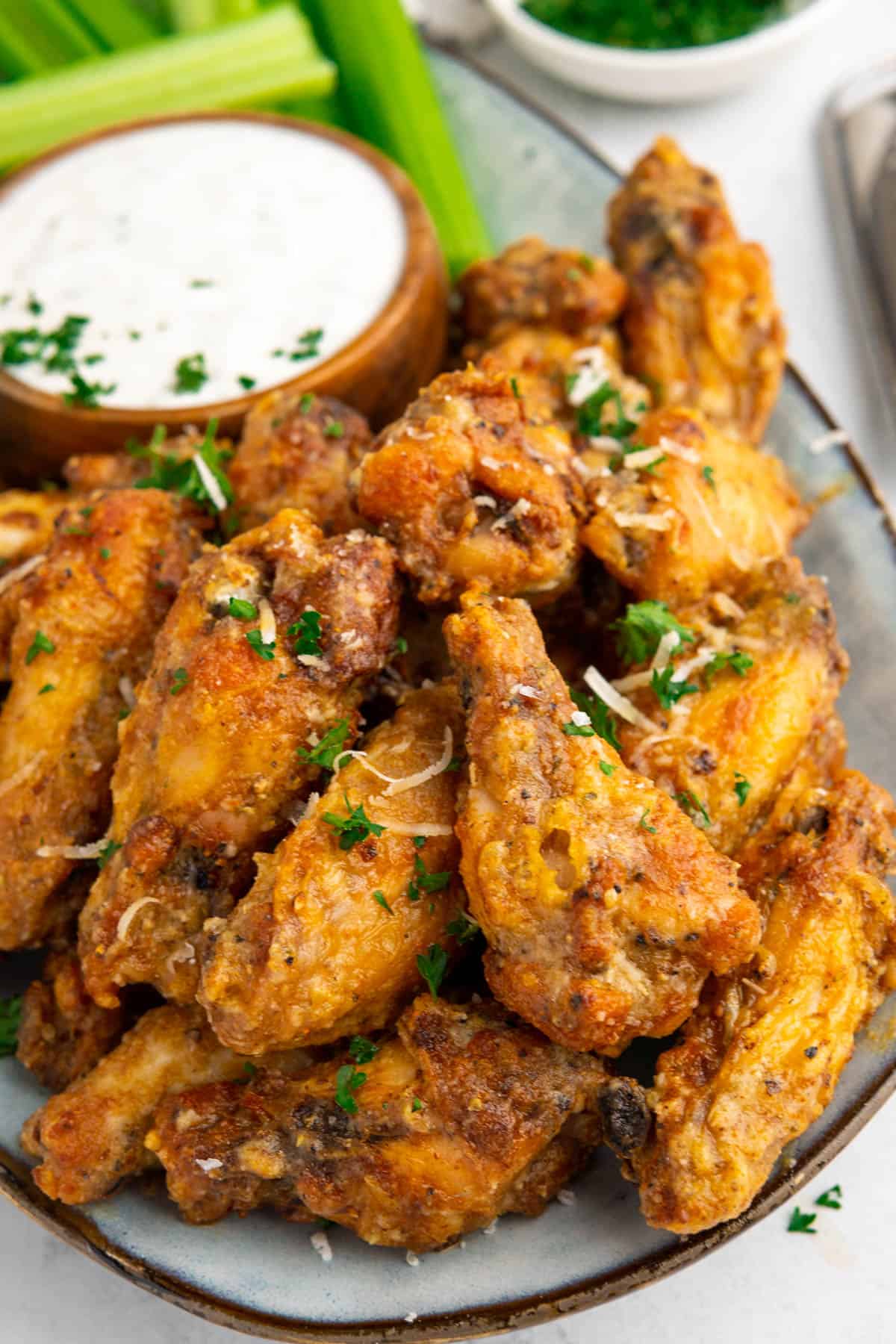 A pile of wings on a platter