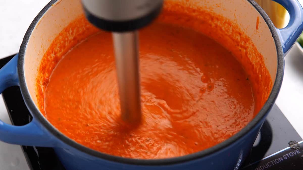 using an immersion blender to make the sauce completely smooth 